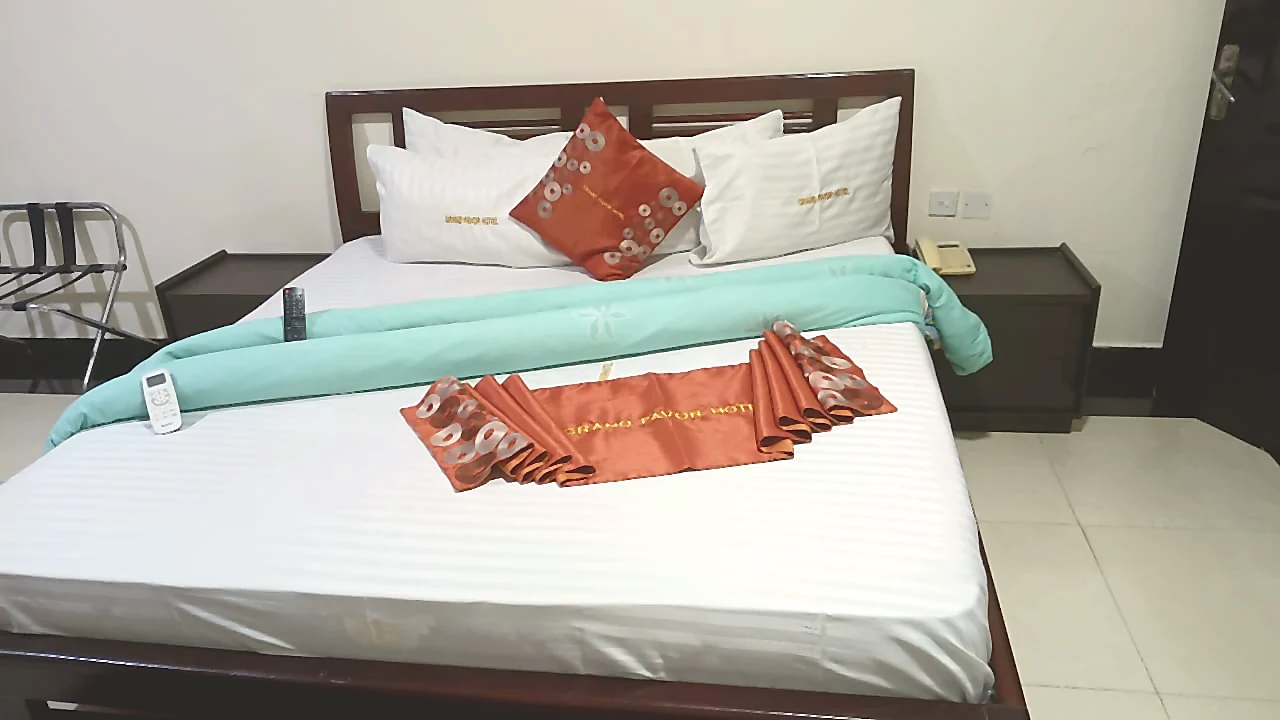 Close detail of Deluxe bed linens at Grand Favor Hotel