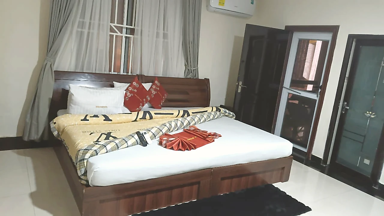 Grand Suite bed with polished interior finishes at Grand Favor Hotel
