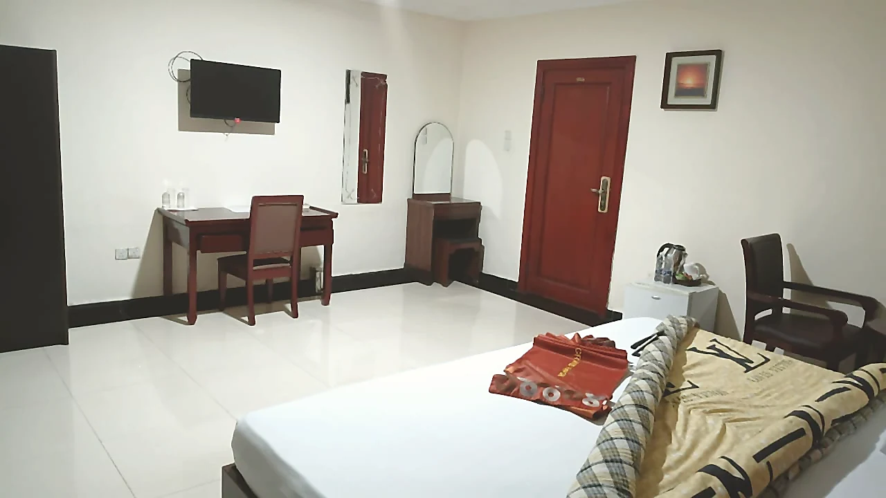 Suite room work desk and spacious floor area at Grand Favor Hotel